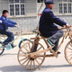 Illustration for article titled Chinese Villager Takes Wooden Bike Out For a Spin